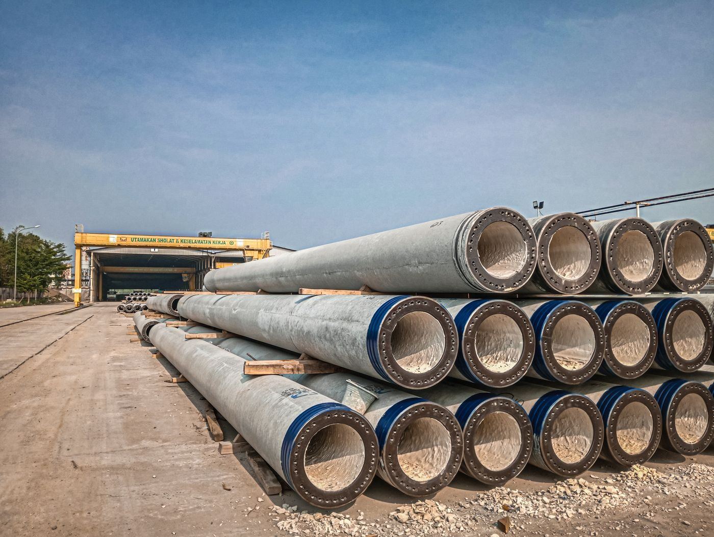 Stacked reinforced concrete pipes at a precast storage yard