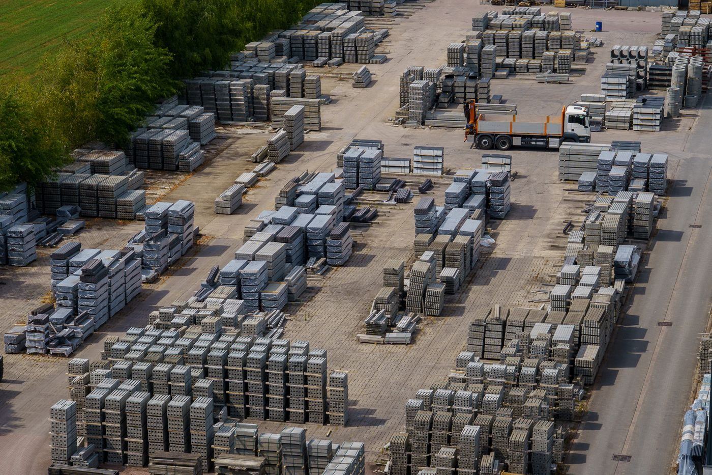 Building materials stacked by the pallet in the yard, ready to load